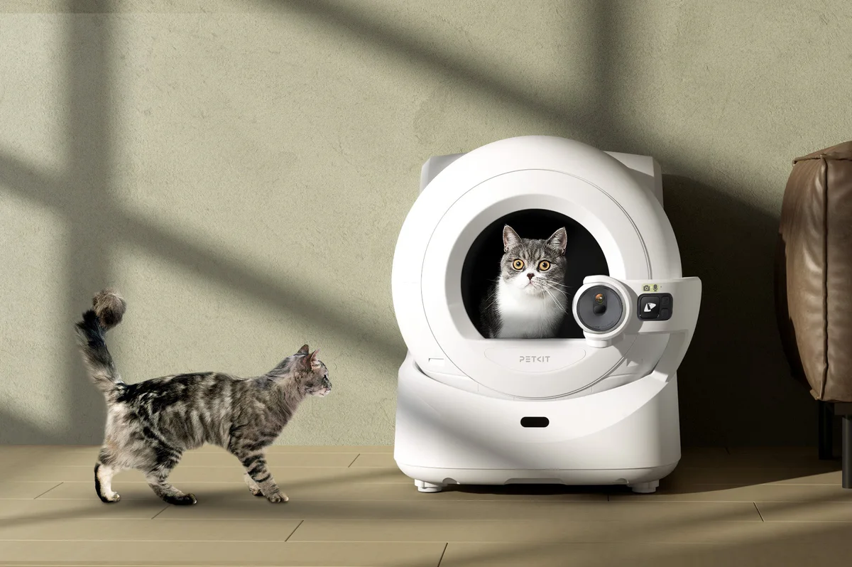 Purobot Ultra Automatic Litter Box placed in a home setting with cats using it naturally as part of daily routines