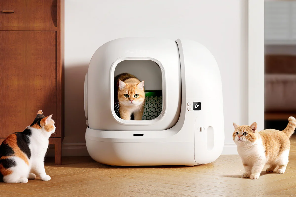 PuraMax 2 Automatic Litter Box displayed in a home setting with cats interacting comfortably with the litter box during everyday use